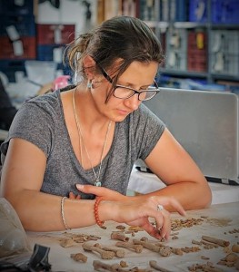 Sorting skeletal remains from a multiple burial.